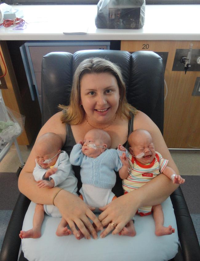 Triplets Grayson, Tiernan and Leon with their mum Laurelea in hospital in December 2012 — aged about a month.