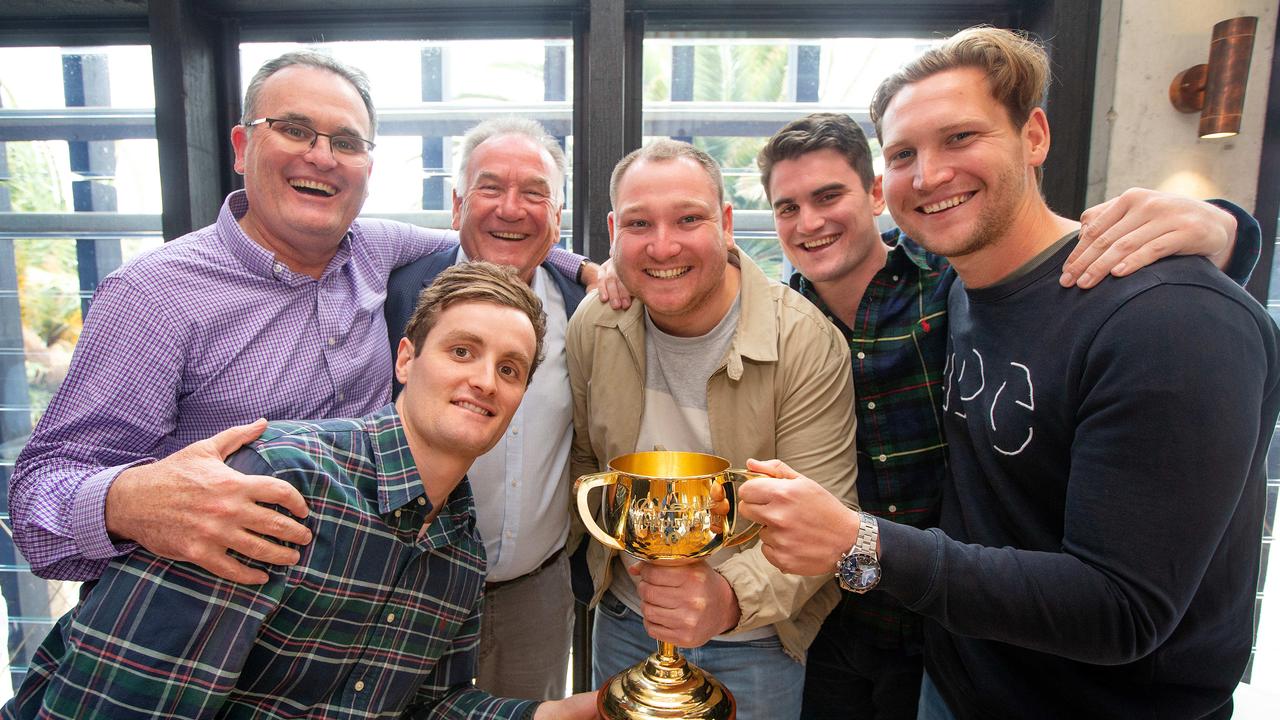 Lanskey family are having lunch at Stokehouse St Kilda to celebrate their horse Vow and Declare winning the Melbourne Cup yesterday. The Lanskey boys, Anthony with sons Ben (2nd from left bending down) and Lachi (2nd from right) and Paul with sons Joseph (centre beige jacket) and Tom (far right). Picture: Mark Stewart