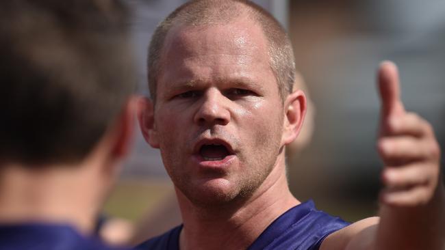 Diggers Rest coach Jamie Lobb talks to his players.