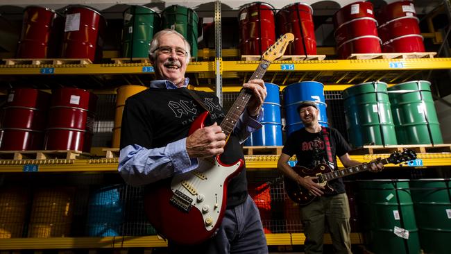 Ross MacDiarmid, front, during his time as CEO of the Royal Australian Mint, celebrating the release of the AC/DC series. Picture: Sean Davey