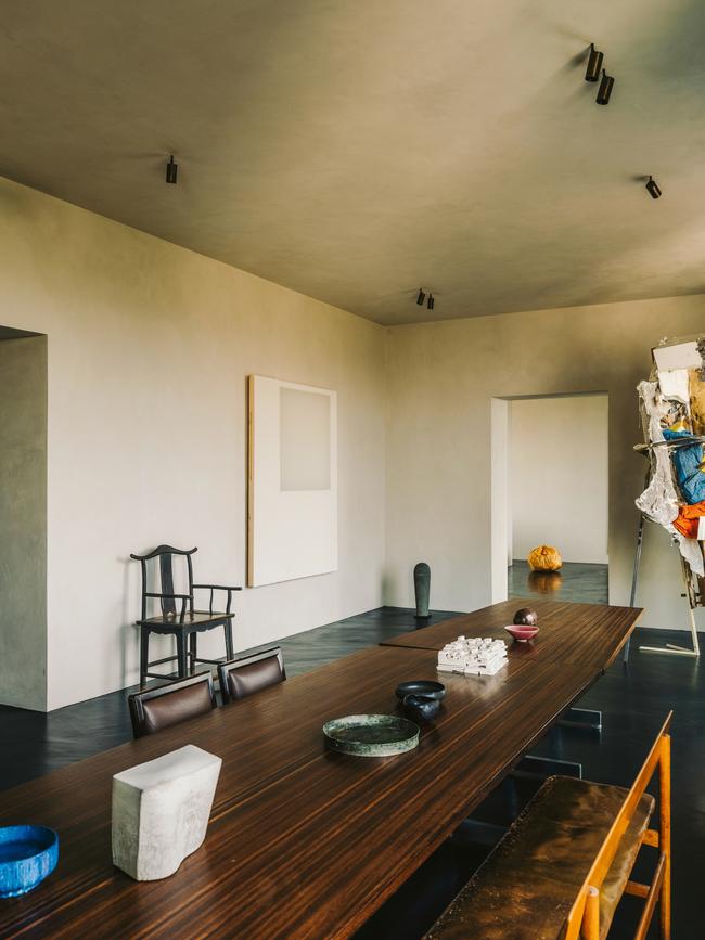 A 23-foot table by Jules Wabbes bisects the dining room. Picture: Salva López for WSJ. Magazine