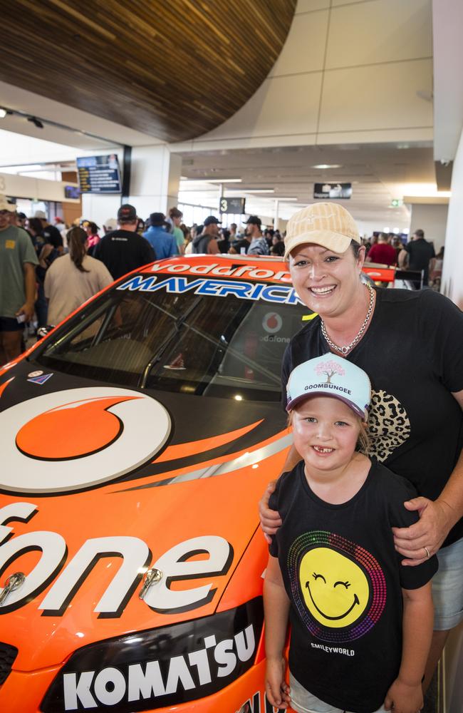Heidi (back) and Charli Gander with a Jamie Whincup race car as V8 Supercars team Red Bull Ampol Racing launch their 2024 livery at Toowoomba Wellcamp Airport, Saturday, February 3, 2024. Picture: Kevin Farmer
