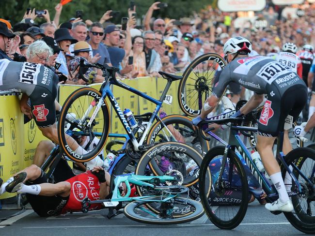 ADELAIDE, AUSTRALIA - JANUARY 18: Crash on last corner with multiple riders during day two of the Tour Down Under on January 18, 2025 in Adelaide, Australia. (Photo by Sarah Reed/Getty Images)