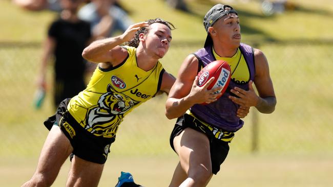 Daniel Rioli chases Shai Bolton. Picture: AFL Media