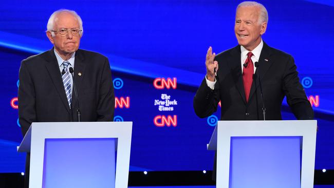 Democratic presidential hopeful former US Vice President Joe Biden, right, next to Vermont Senator Bernie Sanders during the fourth Democratic primary debate in Ohio in October.