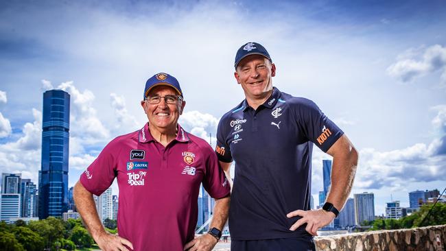 Carlton coach Michael Voss (right) and his Brisbane counterpart Chris Fagan will go head-to-head at the Gabba on Friday night. Picture: Nigel Hallett