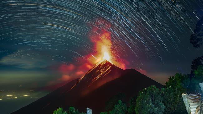Star trails above the erupting Volcan de Fuego near Antigua, Guatemala.