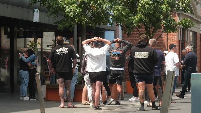 Friends and family of allegedly slain Corio man Jayme Sykes gather in Little Malop St to lay flowers and pay tribute to the 20-year-old.