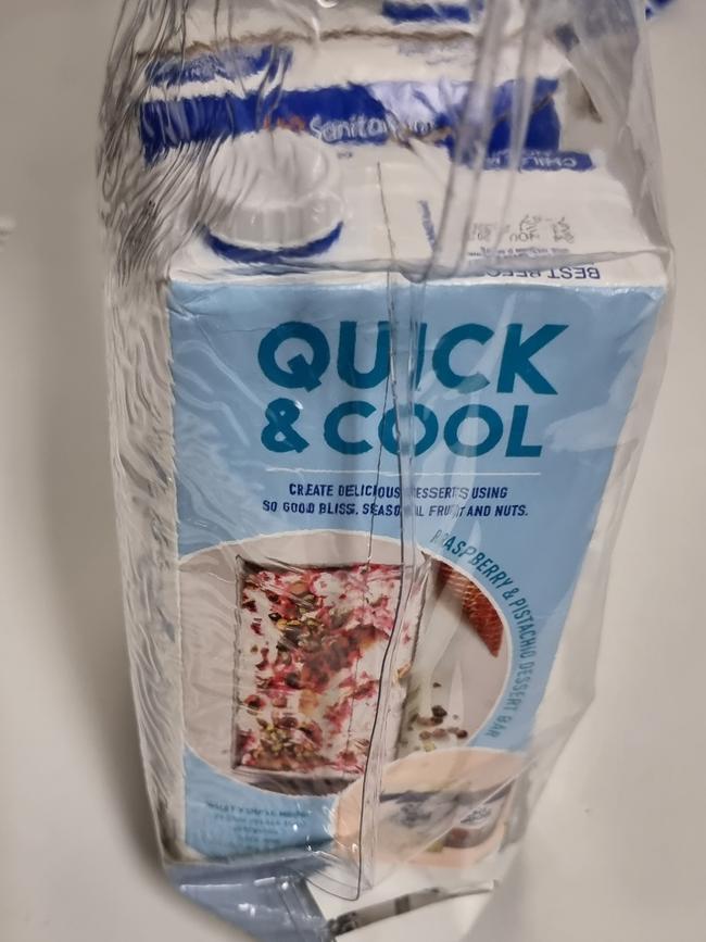 Two soy milk cartons were used to conceal 100 buprenorphine strips, four mobile phones, charging cables and tobacco packets. Picture: NSW Police