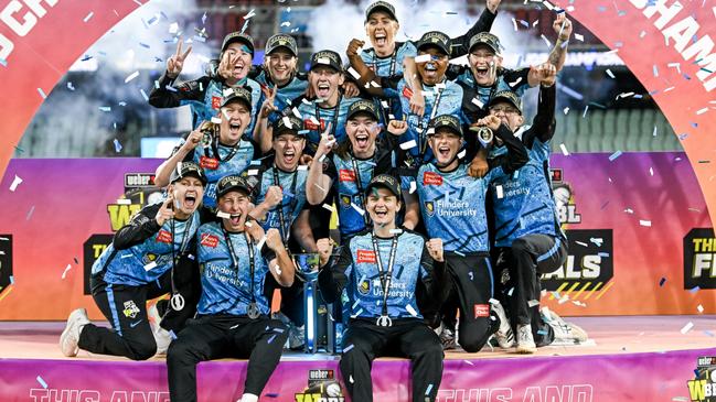 ADELAIDE, AUSTRALIA - DECEMBER 02:The Strikers celebrate on the podium  after winning  the WBBL Final match between Adelaide Strikers and Brisbane Heat at Adelaide Oval, on December 02, 2023, in Adelaide, Australia. (Photo by Mark Brake - CA/Cricket Australia via Getty Images)