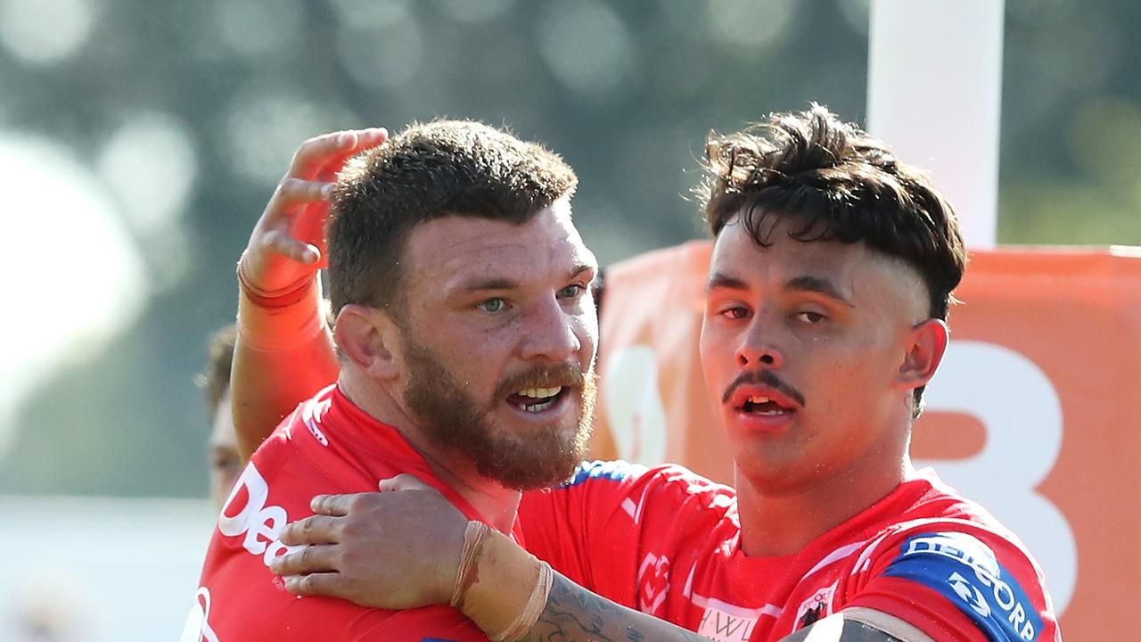 TOOWOOMBA, AUSTRALIA - AUGUST 22: Josh McGuire and Jaiyden Sullivan of the Dragons celebrate Josh McGuire scoring a try during the round 23 NRL match between the St George Illawarra Dragons and the Sydney Roosters at Clive Berghofer Stadium, on August 22, 2021, in Toowoomba, Australia. (Photo by Jono Searle/Getty Images)