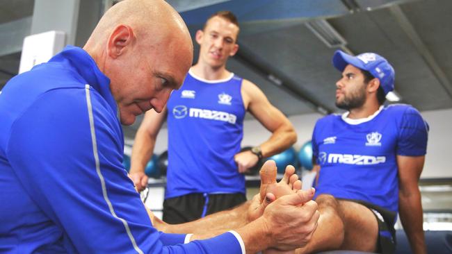 Top medico Steve Saunders works with Daniel Wells during his time at North Melbourne.