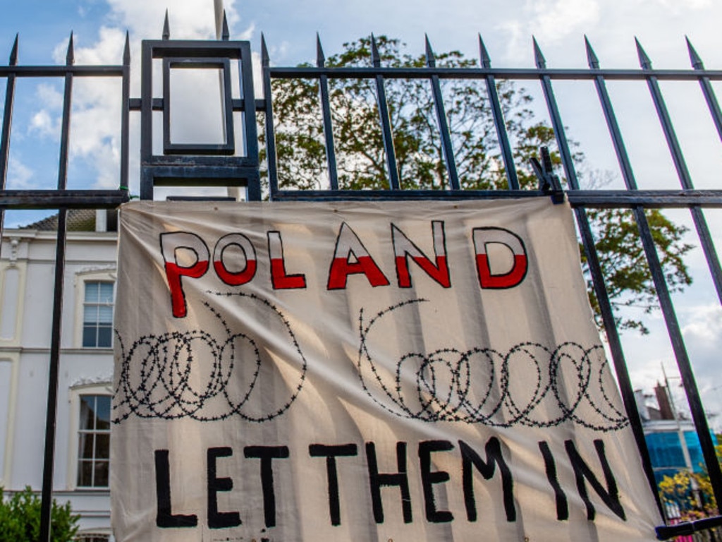 A banner in support of the refugees during a demonstration in support of the refugees stuck in the frontier between Belarus and Poland. Lukashenko has been accused of militarising refugees in revenge against the EU.