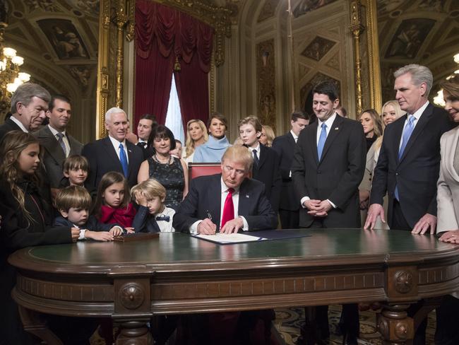 President Donald Trump is joined by the Congressional leadership and his family as he formally signs his cabinet nominations into law on January 20, 2107, in the President’s Room of the Senate on Capitol Hill in Washington. Picture: AP