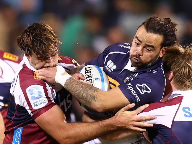 CANBERRA, AUSTRALIA - MAY 17: Andy Muirhead of the Brumbies is tackled during the round fourteen Super Rugby Pacific match between Brumbies and Reds at GIO Stadium, on May 17, 2025, in Canberra, Australia. (Photo by Mark Nolan/Getty Images)