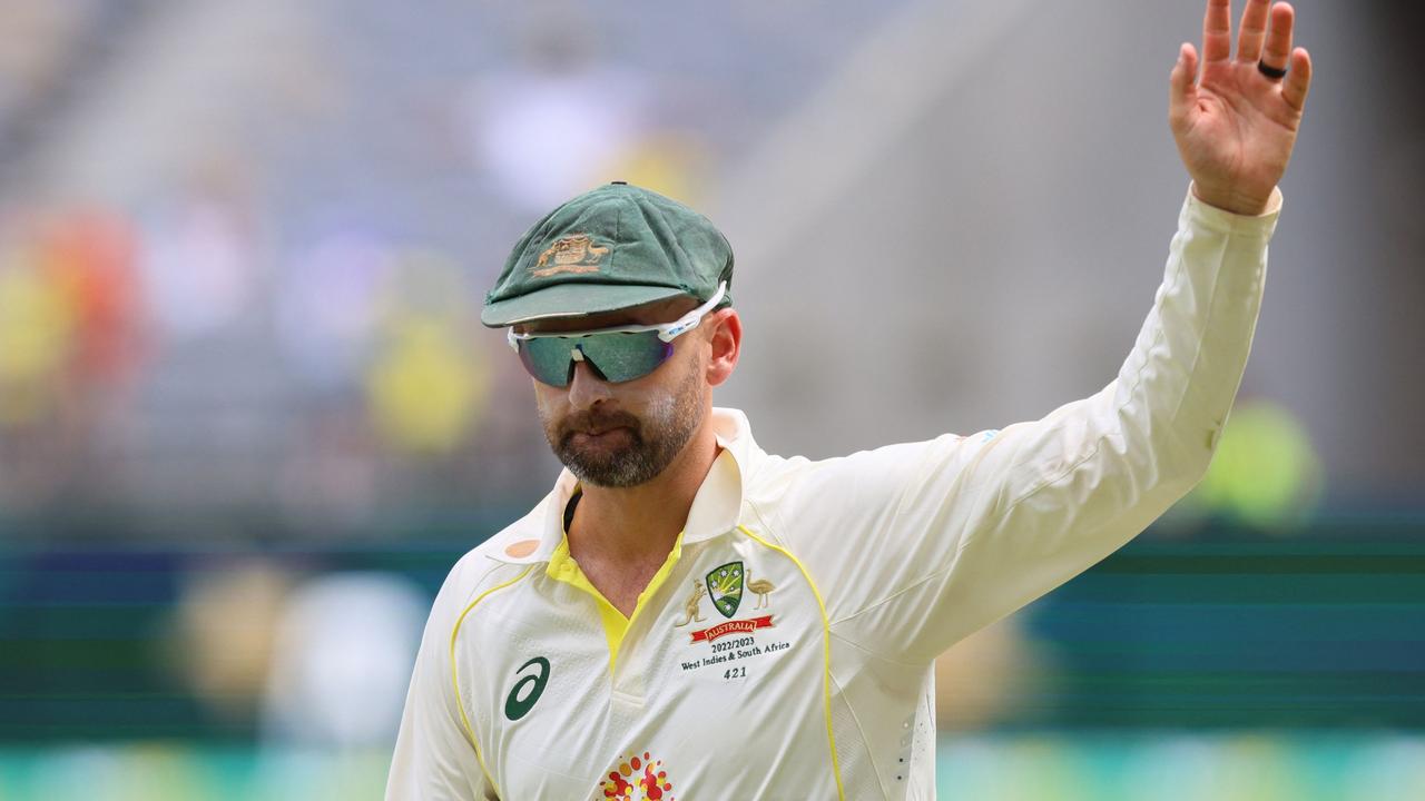 Australia's Nathan Lyon waves to the crowd after Australia won the first test.  AFP