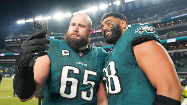 PHILADELPHIA, PENNSYLVANIA - JANUARY 12: Lane Johnson #65 and Jordan Mailata #68 of the Philadelphia Eagles take a selfie after the game against the Green Bay Packers during the NFC Wild Card Playoff at Lincoln Financial Field on January 12, 2025 in Philadelphia, Pennsylvania.   Mitchell Leff/Getty Images/AFP (Photo by Mitchell Leff / GETTY IMAGES NORTH AMERICA / Getty Images via AFP)