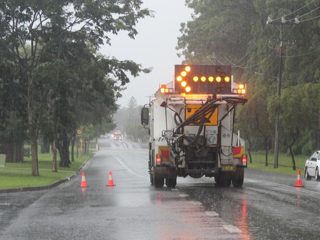 Flooding on Bray St, Coffs Harbour on Wednesday March 18. Cars unwilling to take a 1 minute and 47 second detour drive through floodwaters on Bray St after Council closed the road. Coffs Harbour floods.