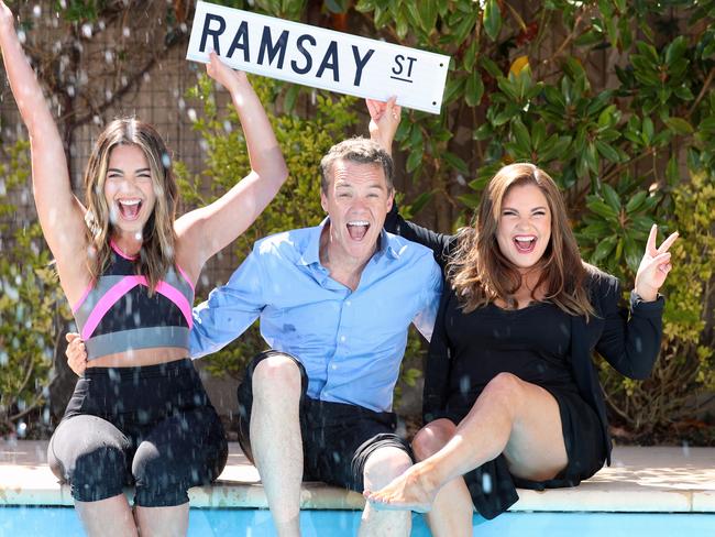 Actors Olympia Valance, Stefan Dennis, and Rebekah Elmaloglou celebrate by the pool. Picture: Alex Coppel