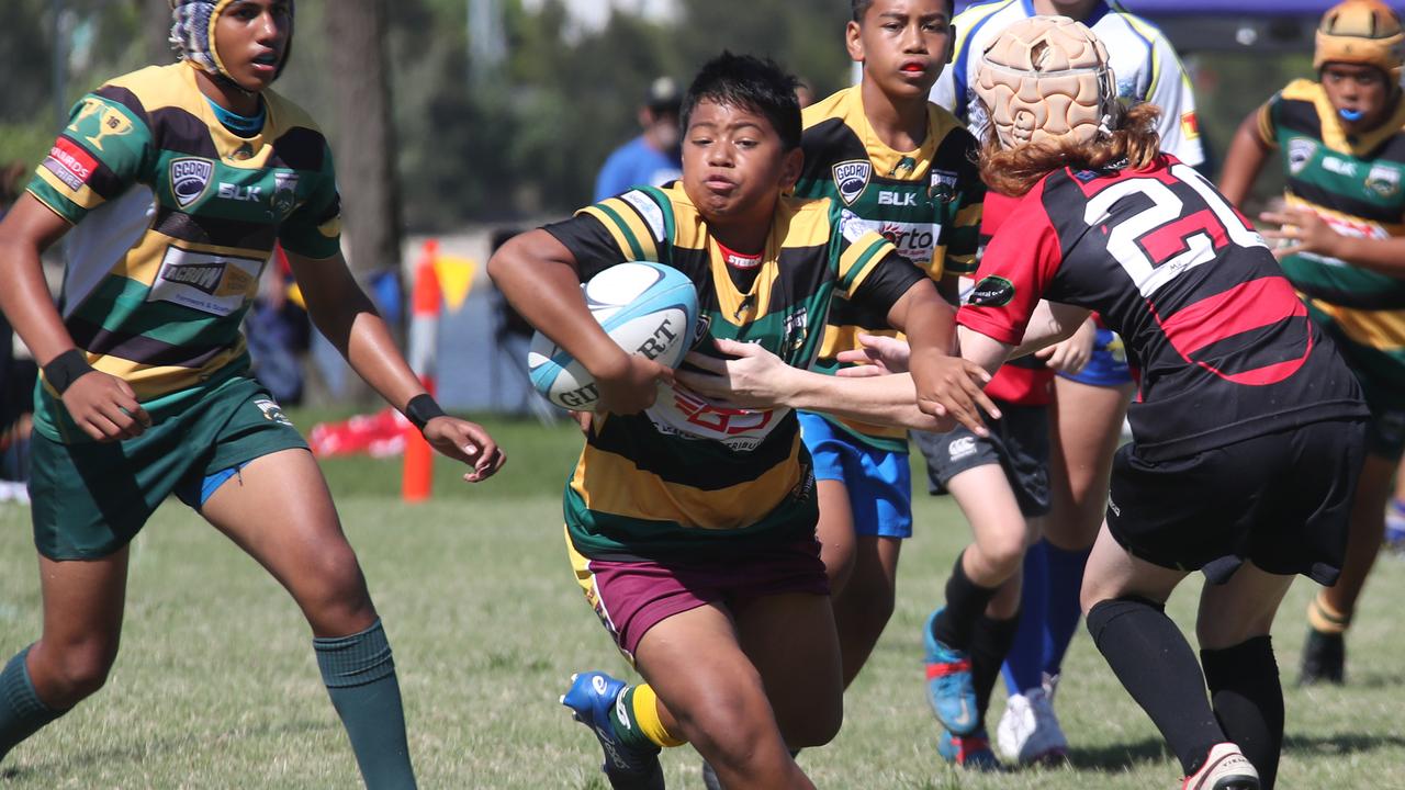 King of the Country U/13 Rugby Union tournament at Overall park Southport. Surfers Paradise(Yellow Green ) V Far North Coast (red black). Picture Glenn Hampson