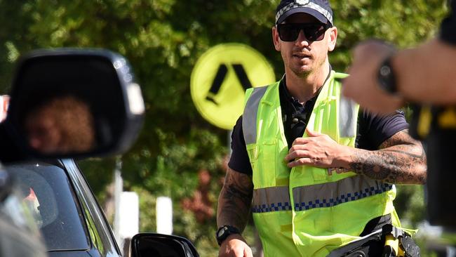 GOLD COAST, AUSTRALIA - NewsWire Photos OCTOBER 12, 2020: Police check cars at the Queensland border with NSW at Griffith Street in Coolangatta. Picture: NCA NewsWire / Steve Holland