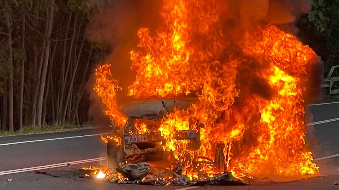 A car burst into flames following a three-vehicle crash in Sippy Downs this morning. Picture: Craig Wilson