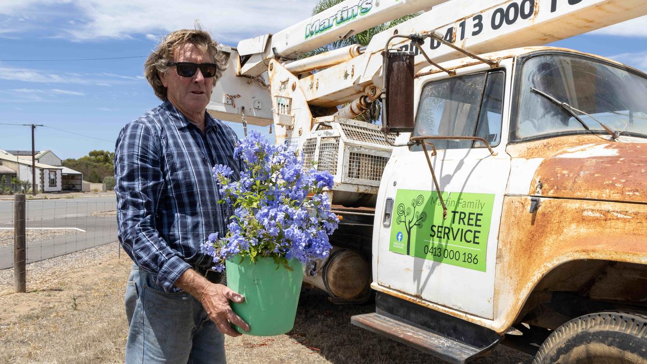 John Dutschke places flowers at the truck of Kevin Martin in Arthurton after the death of Kevin Martin who died in a workplace accident. Picture: Kelly Barnes