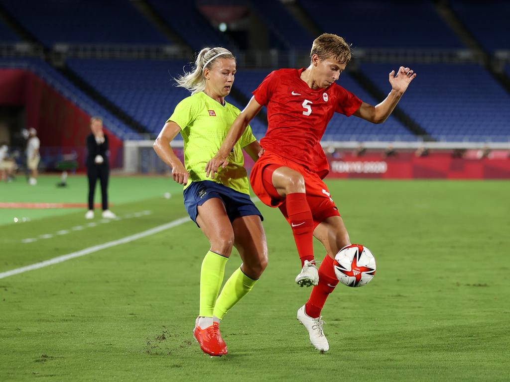 Quinn battles for possession during the gold medal match. (Photo by Naomi Baker/Getty Images)