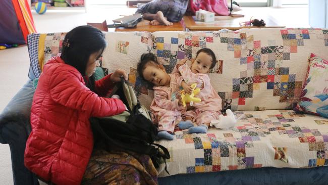 Mum Bhumchu Zangmo with Nima [left], and Dawa [right] at the Children First Foundation Miracle Smiles Retreat in Kilmore. Picture: Alex Coppel