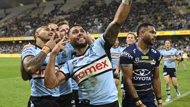 Jesse Ramien celebrates his try with Sharks teammates against the Cowboys. Picture: Ian Hitchcock/Getty Images