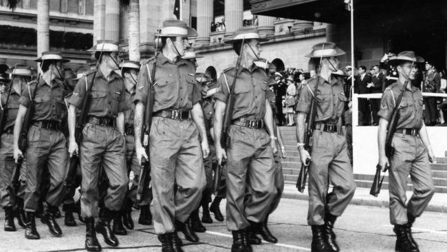 ‘Faithful service’ ... Vietnam veterans march past Brisbane City Hall in 1967. Picture: Courier Mail