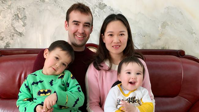 Malcolm Scriber with his wife Wenjuan and children Eli, 3, and Luna, 11 months, at his in-laws’ apartment in Wuhan on Friday. Picture: June Scriber