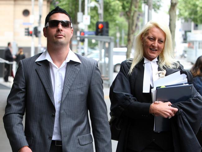 Justin Gatto, the son of Mick Gatto, leaving the County Court with Gobbo. 