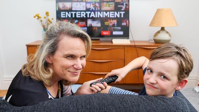 Claire Rosel and son Clancy 10, fight over a TV remote. Picture: Brendan Beckett