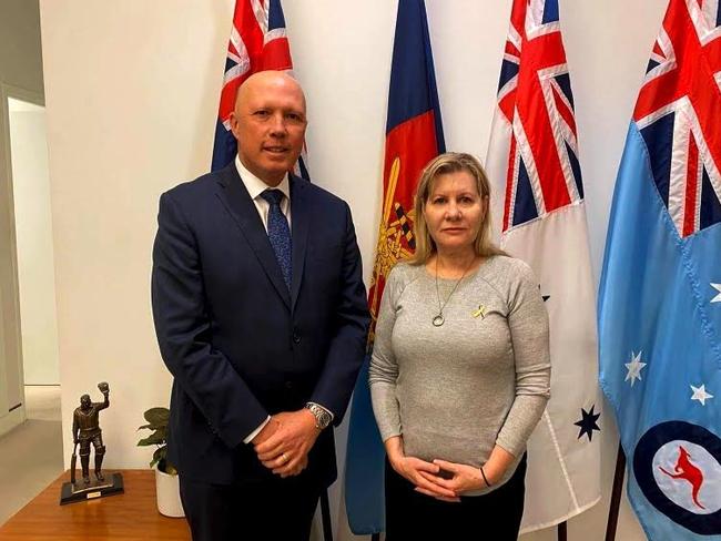 Defence Minister Peter Dutton with Julie-Ann Finney following a private meeting in Canberra.