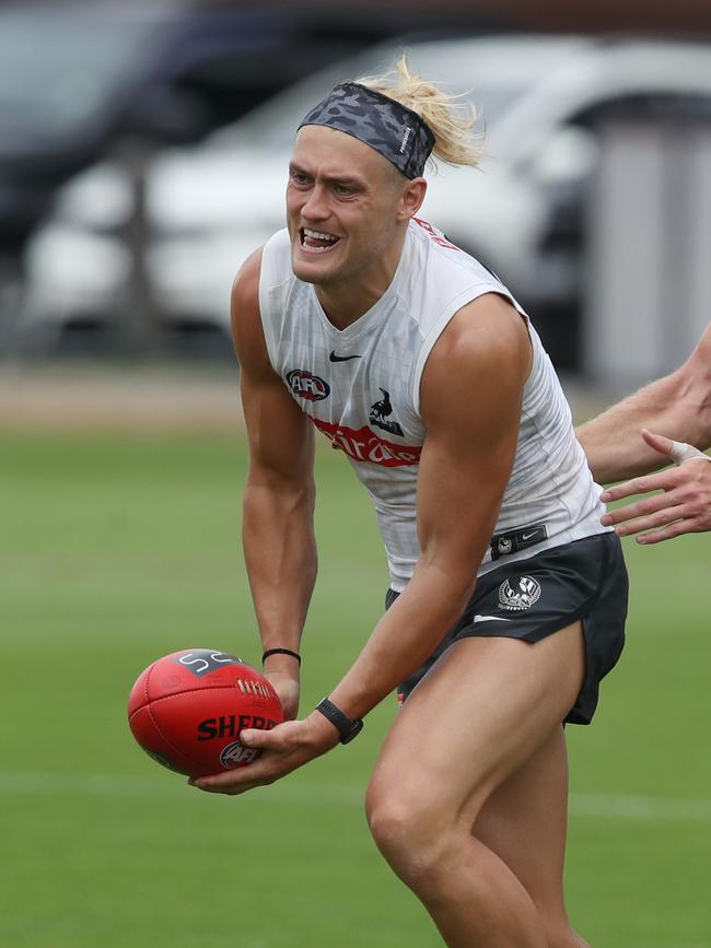 The Pies remain hopeful Darcy Moore will play in their season opener. Picture: David Crosling