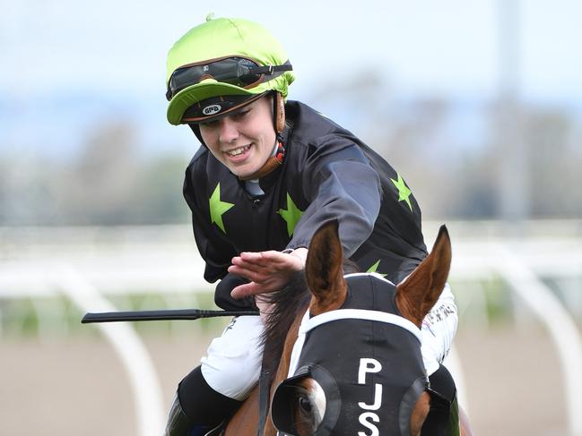 PAKENHAM, AUSTRALIA - DECEMBER 04: Madison Lloyd riding Defiant Dancer after winning race 6, the Schweppes David Bourke Memorial Handicap, during Pakenham Cup Day at Pakenham Racecourse on December 04, 2021 in Pakenham, Australia. (Photo by Vince Caligiuri/Getty Images)