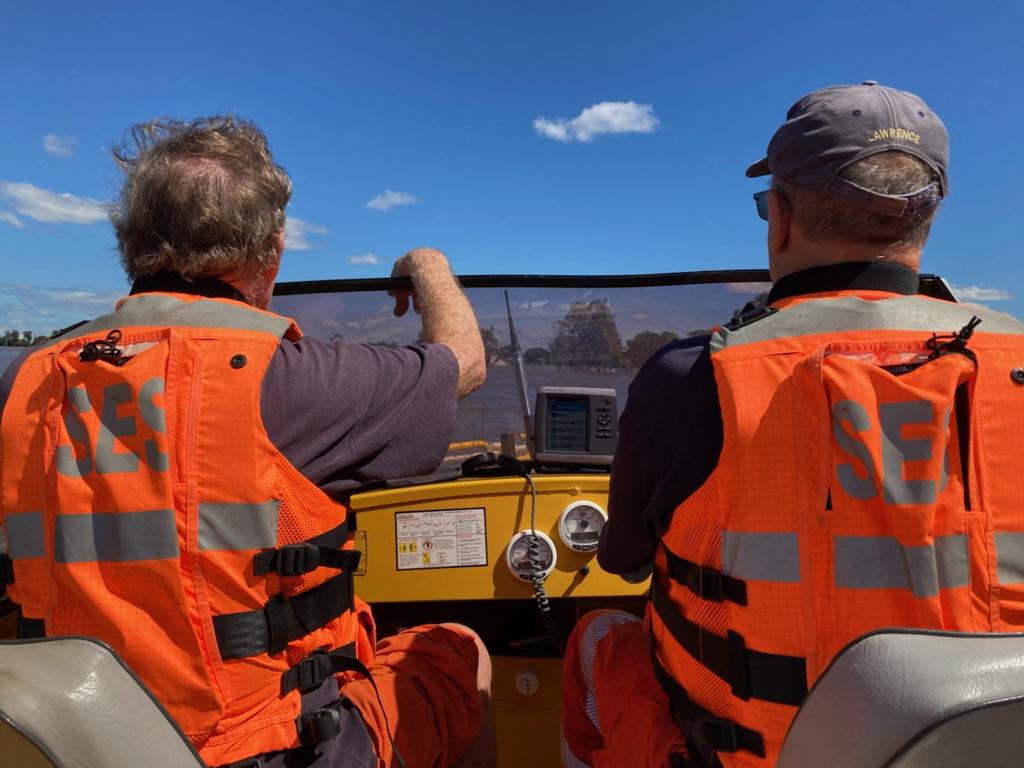 Lawrence SES make their way up Sportsmans Creek to carry out a flood rescue (March 24, 2021).