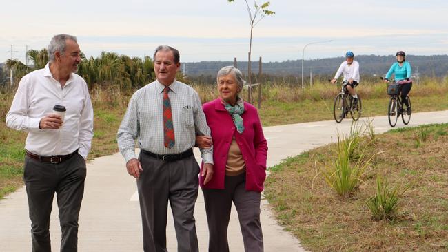 Clarence MP Chris Gulaptis with Clarence Valley Council Mayor Jim Simmons and his wife Lexie. A cycleway from Townsend to Maclean will be completed with state government funding.Bob and Judith Little from Maclean (in background) are frequent users of the pathway that traverses from the Maclean Interchange to Townsend and are looking forward to it linking to existing pathways at Townsend and Maclean.