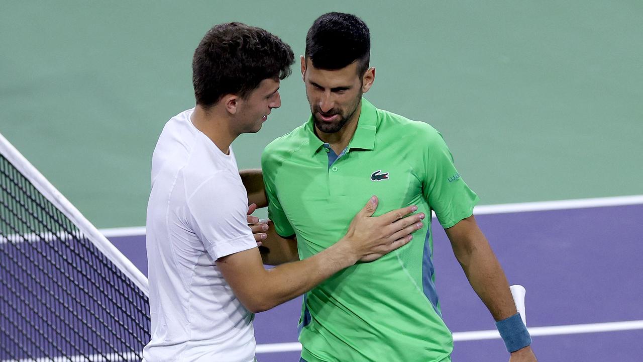 INDIAN WELLS, CALIFORNIA - MARCH 11: Luca Nardi of Italy is congratulated by Novak Djokovic of Serbia after their match during the BNP Paribas Open at Indian Wells Tennis Garden on March 11, 2024 in Indian Wells, California. Matthew Stockman/Getty Images/AFP (Photo by MATTHEW STOCKMAN / GETTY IMAGES NORTH AMERICA / Getty Images via AFP)