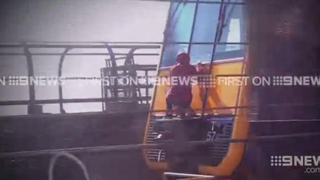 Supplied Channel 9 video stills of "train surfing" on the Sydney Harbour Bridge.