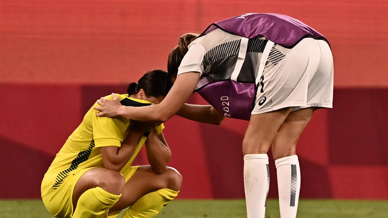 Sam Kerr is consoled by a US player after the bronze medal playoff.