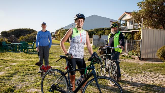 Helen Donovan from Walking SA with her dog and cyclists Serafina Tane and Sam Powrie at Tennyson. Picture: Matt Turner