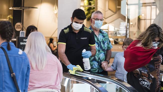 Employees cleaning Chadstone escalators during the Boxing Day sales. Picture: Naomi Rahim/Getty Images