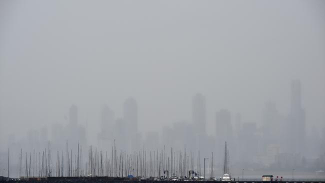 Melbourne’s skyline obscured by heavy rain today.