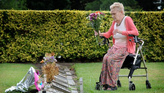 Julie Maybury visiting the grave of her murdered daughter Kylie at Fawkner Cemetery. Picture: Andrew Henshaw