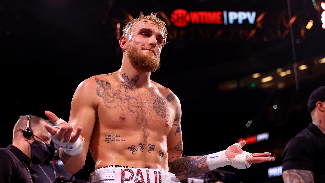 Jake Paul reacts to knocking out Tyron Woddley in the sixth round during a fight on December 18, 2021 in Tampa, Florida. (Photo by Mike Ehrmann/Getty Images)