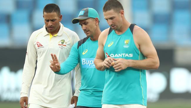 Justin Langer (C) Usman Khawaja (L) and Shaun Marsh during day three of the Test in Dubai. Picture: Getty Images