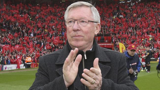 MANCHESTER, ENGLAND - MAY 12:  Manager Sir Alex Ferguson of Manchester United is given a guard of honour by both teams ahead of the Barclays Premier League match between Manchester United and Swansea at Old Trafford on May 12, 2013 in Manchester, England.  (Photo by John Peters/Manchester United via Getty Images)