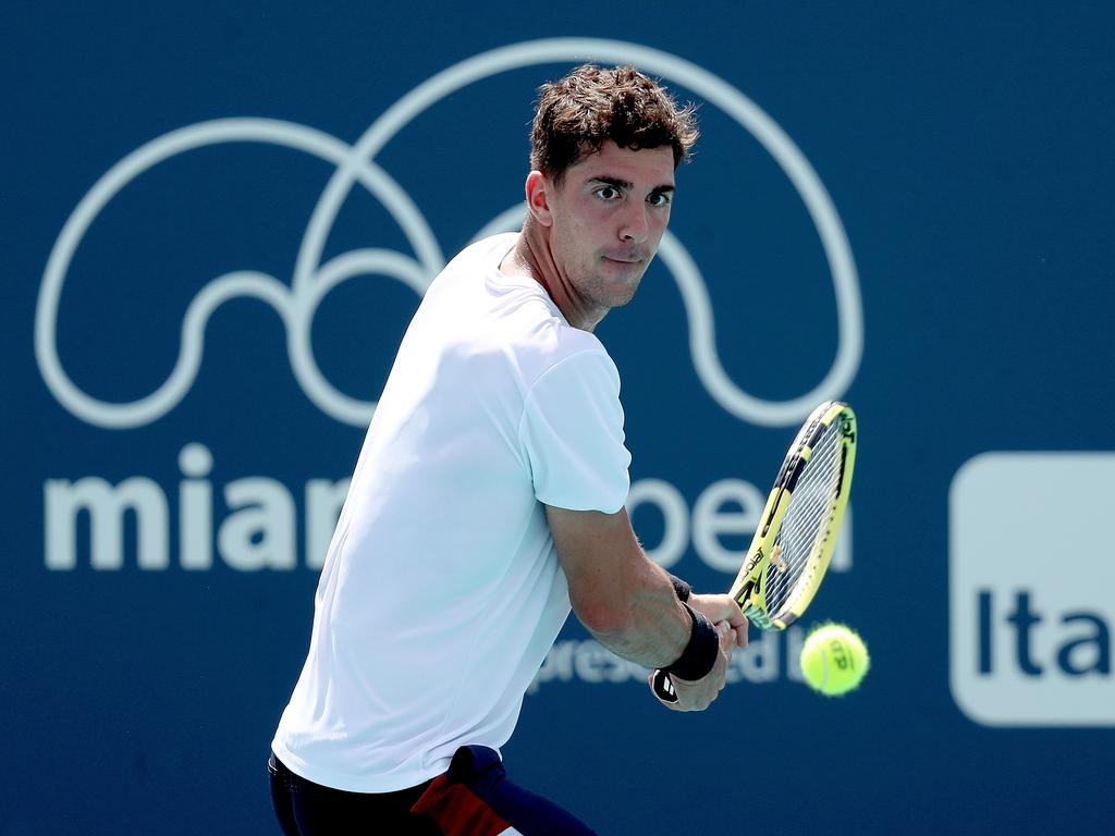 Thanasi Kokkinakis returns a shot to Shintaro Mochizuki. (Photo by Matthew Stockman/Getty Images)